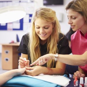 Girl Painting Nails in Michigan Beauty School