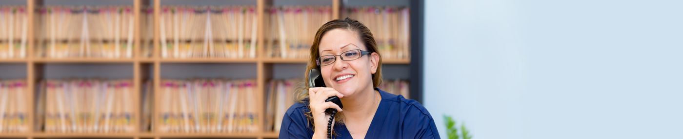 Medical administration and billing professional on the phone. 