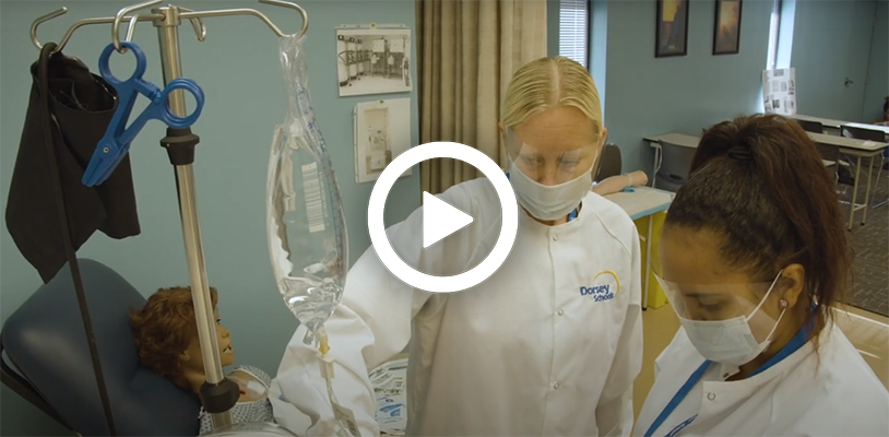 Video play button with a Dialysis Patient Care Technician training a student. 