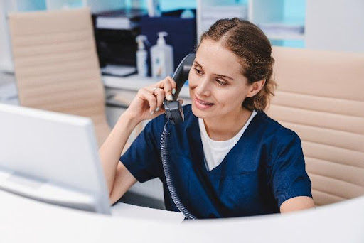 medical office medical assistant answering a phone